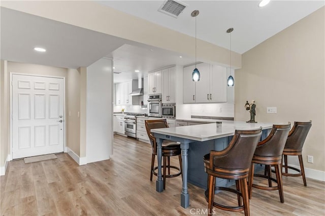 dining area featuring baseboards, light wood-type flooring, and recessed lighting
