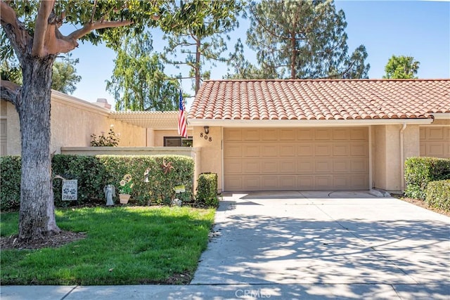 view of front facade featuring concrete driveway, stucco siding, a garage, and a tiled roof