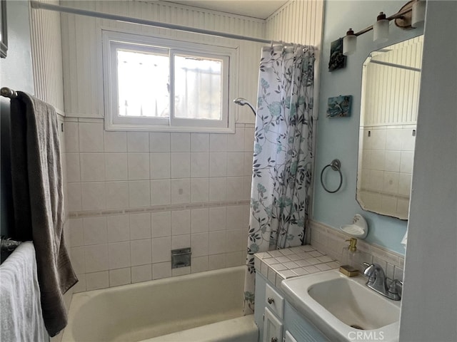 bathroom with shower / bath combination with curtain and vanity