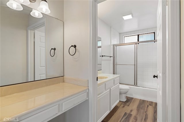 676 Shepard St Unit 6, San Pedro, CA 90731 - bathroom with vanity, toilet, shower / bath combination with glass door, and wood finished floors
