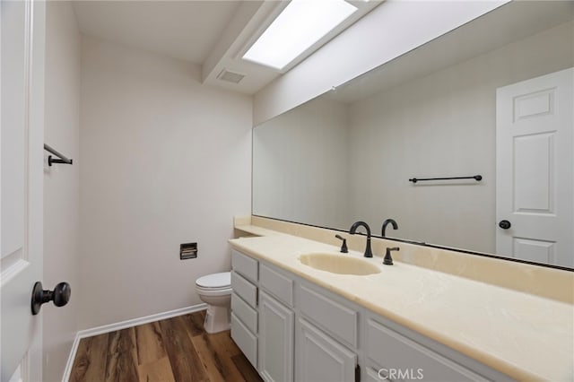 676 Shepard St Unit 6, San Pedro, CA 90731 - bathroom with vanity, wood finished floors, toilet, and baseboards