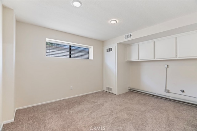676 Shepard St Unit 6, San Pedro, CA 90731 - unfurnished room featuring light carpet, baseboards, and a baseboard radiator