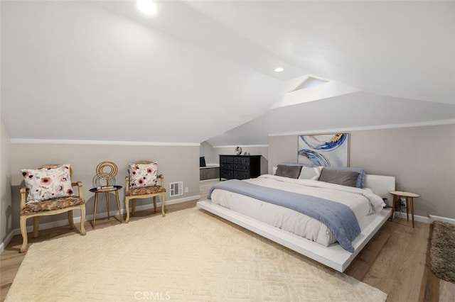 5653 Franklin Ave, Los Angeles, CA 90028 - bedroom featuring vaulted ceiling, wood finished floors, baseboards, and recessed lighting