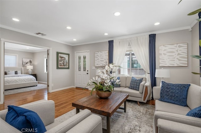 5653 Franklin Ave, Los Angeles, CA 90028 - living room with wood finished floors, recessed lighting, crown molding, and baseboards