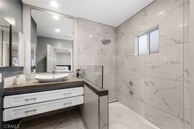 5653 Franklin Ave, Los Angeles, CA 90028 - bathroom with shower / washtub combination, vanity, marble finish floors, and recessed lighting