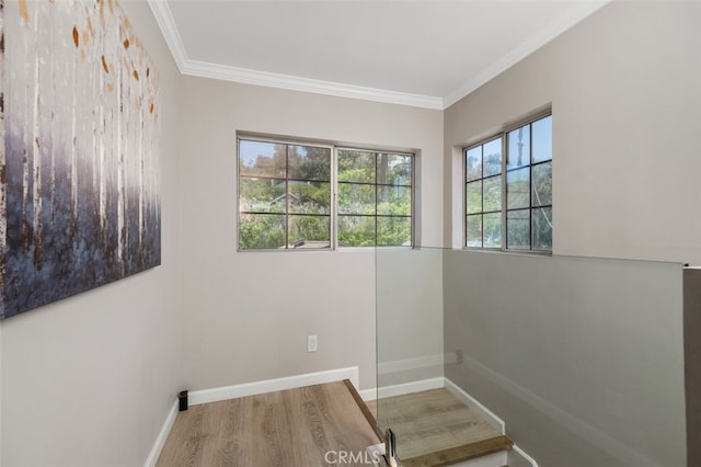 5653 Franklin Ave, Los Angeles, CA 90028 - empty room with wood finished floors, crown molding, and baseboards