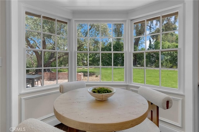 sunroom / solarium featuring plenty of natural light