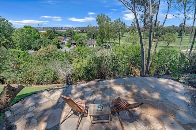 view of patio / terrace with view of wooded area
