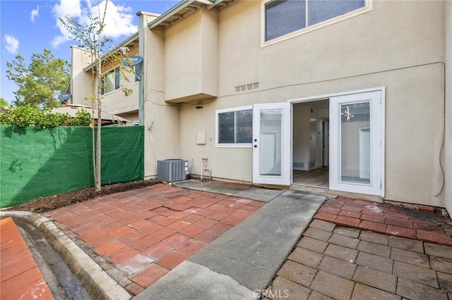 1326 Via Del Rio, Corona, CA 92882 - back of house featuring a patio area, stucco siding, central air condition unit, and fence