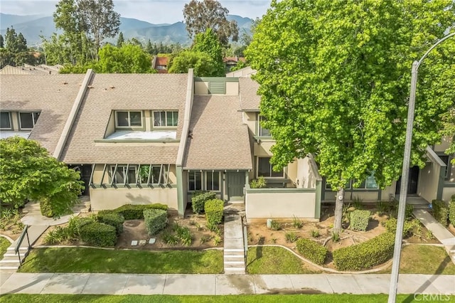 1326 Via Del Rio, Corona, CA 92882 - view of front facade with a shingled roof, a mountain view, and stucco siding