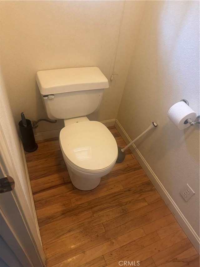 5625 Headwaters Rd, Forest Ranch, CA 95942 - bathroom featuring baseboards, wood finished floors, and toilet