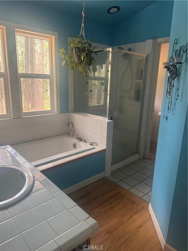 5625 Headwaters Rd, Forest Ranch, CA 95942 - bathroom with healthy amount of natural light, wood finished floors, and a stall shower