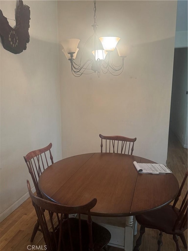5625 Headwaters Rd, Forest Ranch, CA 95942 - dining space featuring a chandelier, light wood finished floors, and baseboards