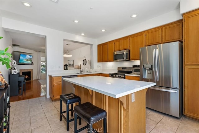 31 Tulare, Aliso Viejo, CA 92656 - kitchen with appliances with stainless steel finishes, light countertops, light tile patterned floors, and recessed lighting