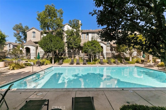 31 Tulare, Aliso Viejo, CA 92656 - community pool featuring a patio area and a residential view