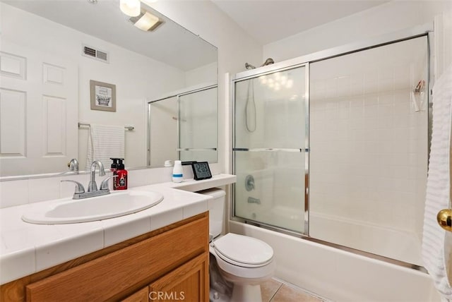 31 Tulare, Aliso Viejo, CA 92656 - full bathroom featuring vanity, enclosed tub / shower combo, toilet, and tile patterned floors