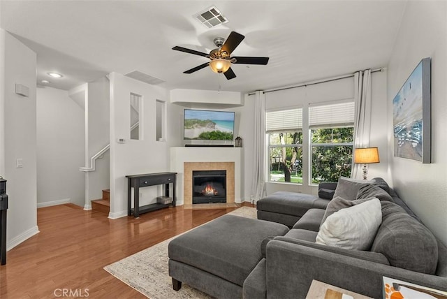31 Tulare, Aliso Viejo, CA 92656 - living room with ceiling fan, wood finished floors, stairs, a fireplace, and baseboards