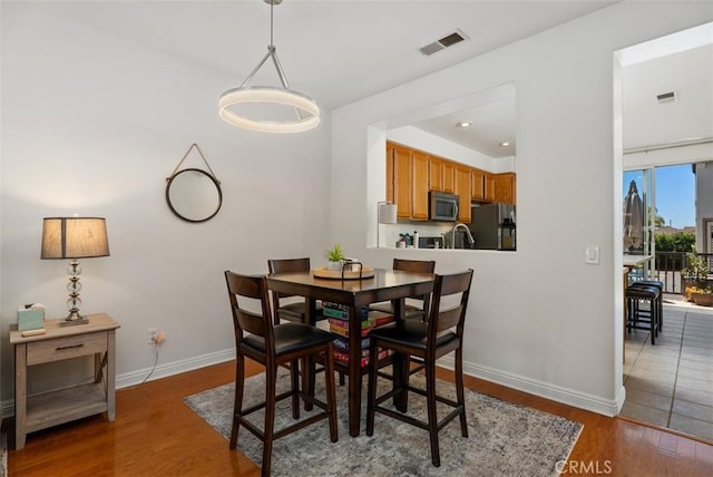 31 Tulare, Aliso Viejo, CA 92656 - dining area with wood finished floors and baseboards