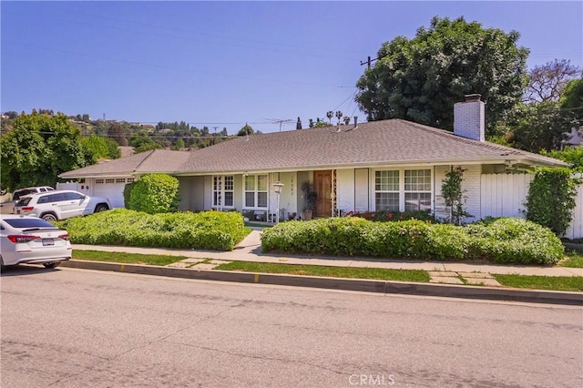 16060 Villa Flores Dr, Hacienda Heights, CA 91745 - single story home featuring a garage, a chimney, and brick siding
