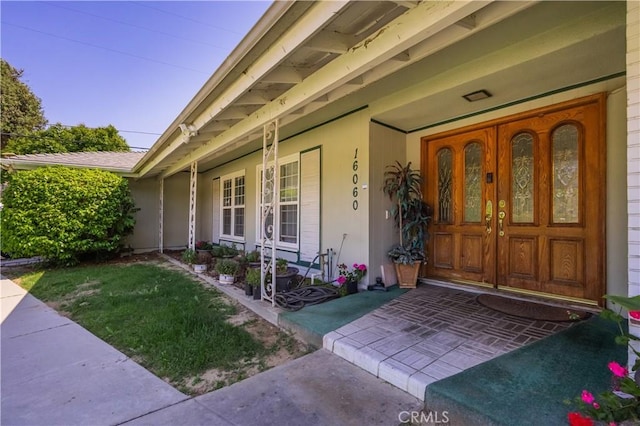 16060 Villa Flores Dr, Hacienda Heights, CA 91745 - doorway to property featuring a porch and stucco siding