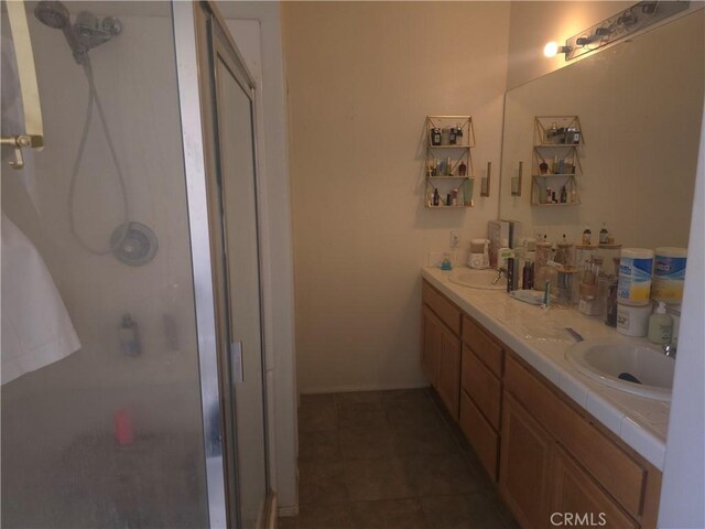 242 Spinnaker St, San Jacinto, CA 92583 - bathroom featuring a stall shower and double vanity