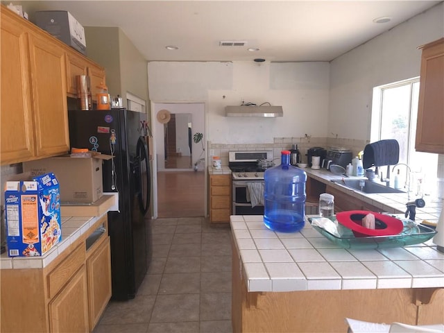 242 Spinnaker St, San Jacinto, CA 92583 - kitchen featuring range with two ovens, tile countertops, ventilation hood, tile patterned flooring, and tasteful backsplash