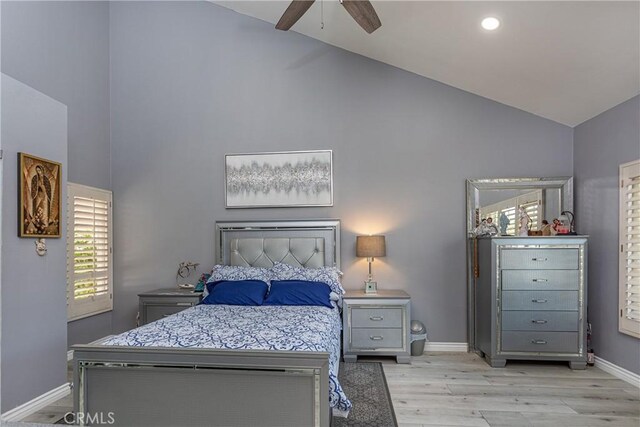 14048 Wagon Mound Rd, Rancho Cascades, CA 91342 - bedroom featuring high vaulted ceiling, light wood-style floors, baseboards, multiple windows, and a ceiling fan