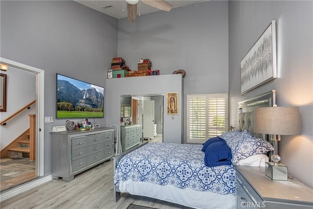 14048 Wagon Mound Rd, Rancho Cascades, CA 91342 - bedroom with a high ceiling, wood finished floors, and a ceiling fan