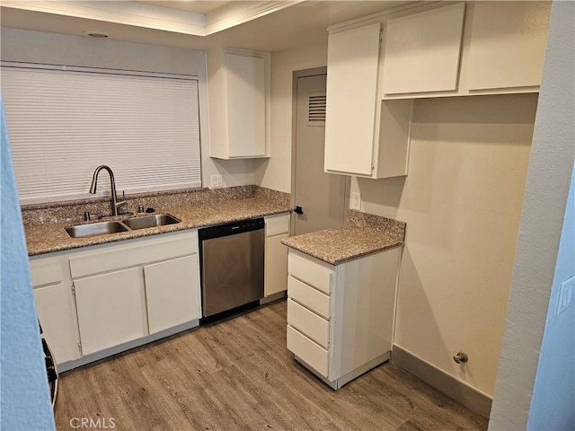 12860 Perris Blvd Unit D6, Moreno Valley, CA 92553 - kitchen featuring dishwasher, light wood-style flooring, a sink, and white cabinets