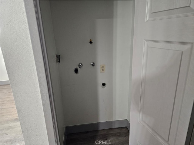 12860 Perris Blvd Unit D6, Moreno Valley, CA 92553 - laundry room with electric dryer hookup, wood finished floors, hookup for a washing machine, and baseboards