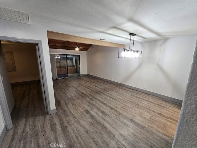 12860 Perris Blvd Unit D6, Moreno Valley, CA 92553 - unfurnished dining area featuring wood finished floors, a textured ceiling, and baseboards