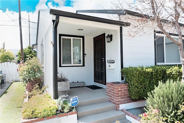 5253 Deeboyar, Lakewood, CA 90712 - doorway to property featuring board and batten siding