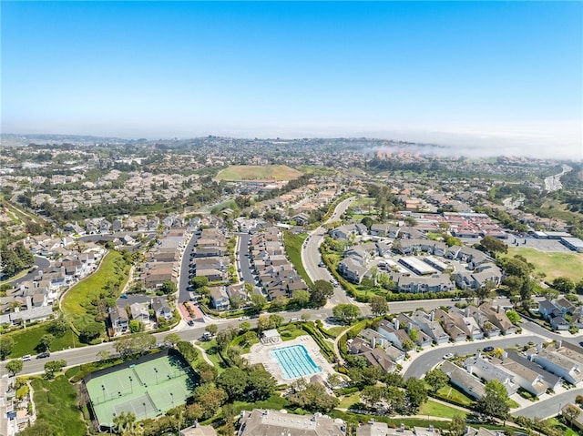 aerial view of property and surrounding area with nearby suburban area