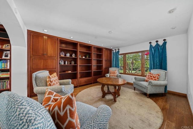 sitting room with recessed lighting, wood finished floors, and baseboards