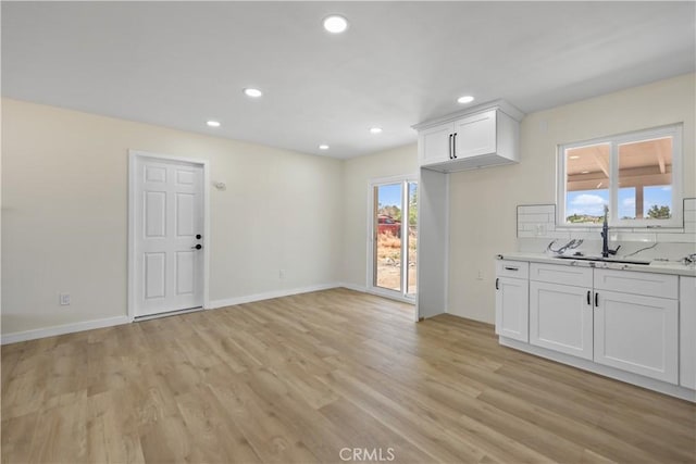 40635 159th St E, Lancaster, CA 93535 - kitchen featuring a sink, light wood finished floors, recessed lighting, white cabinetry, and light countertops