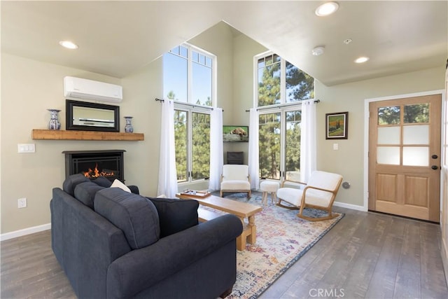 1517 Woodland Dr, Pine Mountain Club, CA 93222 - living area with a wall mounted air conditioner, baseboards, a warm lit fireplace, wood finished floors, and recessed lighting