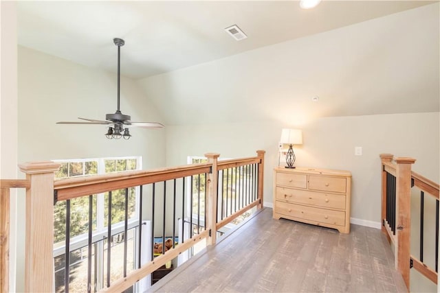 1517 Woodland Dr, Pine Mountain Club, CA 93222 - corridor featuring vaulted ceiling, wood finished floors, an upstairs landing, and baseboards