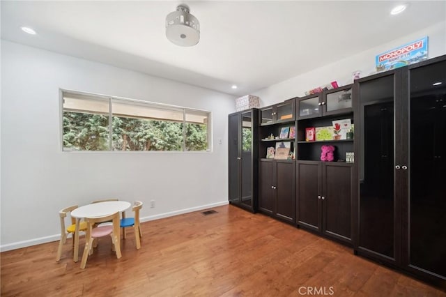 12218 Sarazen Pl, Granada Hills, CA 91344 - playroom with wood finished floors, baseboards, and recessed lighting