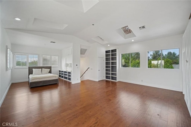 12218 Sarazen Pl, Granada Hills, CA 91344 - unfurnished room featuring healthy amount of natural light, baseboards, dark wood finished floors, vaulted ceiling, and a skylight