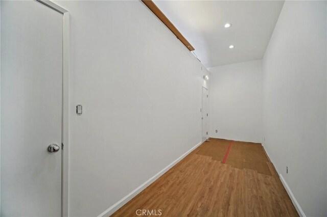 12218 Sarazen Pl, Granada Hills, CA 91344 - hall featuring recessed lighting, wood finished floors, and baseboards