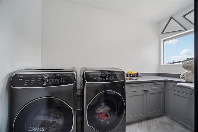 12218 Sarazen Pl, Granada Hills, CA 91344 - laundry room with washer and dryer and cabinet space