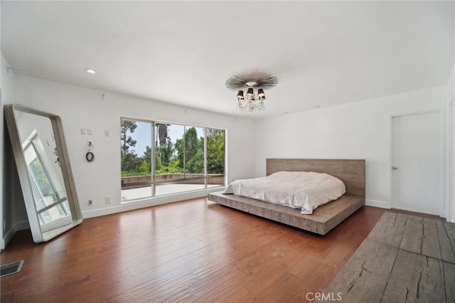 12218 Sarazen Pl, Granada Hills, CA 91344 - bedroom with access to outside, a chandelier, wood finished floors, and baseboards