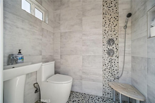 12218 Sarazen Pl, Granada Hills, CA 91344 - full bathroom featuring a tile shower, toilet, and tile walls