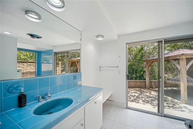 12218 Sarazen Pl, Granada Hills, CA 91344 - bathroom with plenty of natural light, tile patterned floors, baseboards, and vanity