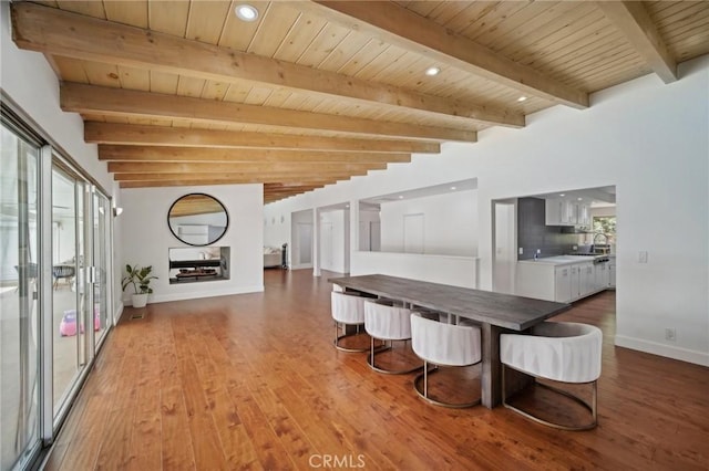 12218 Sarazen Pl, Granada Hills, CA 91344 - dining area featuring wooden ceiling, beamed ceiling, wood finished floors, baseboards, and recessed lighting