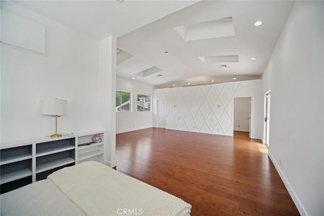 12218 Sarazen Pl, Granada Hills, CA 91344 - bedroom with wood finished floors, a skylight, baseboards, vaulted ceiling, and recessed lighting