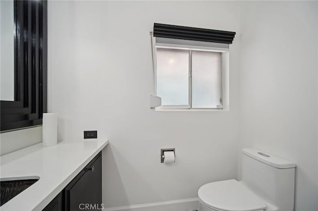 12218 Sarazen Pl, Granada Hills, CA 91344 - half bath with toilet, vanity, and baseboards