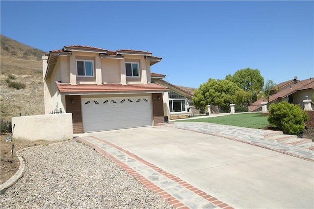 16971 Lakepointe Dr, Riverside, CA 92503 - traditional-style house featuring stucco siding, driveway, a garage, a tiled roof, and a front yard