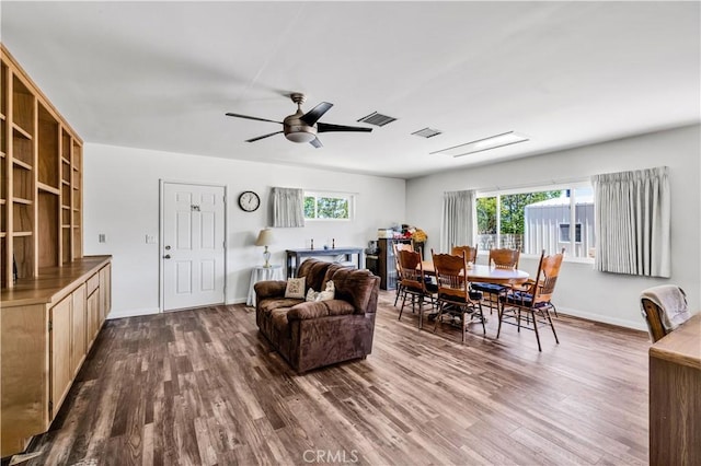 7599 Joshua Ln, Yucca Valley, CA 92284 - living room featuring dark wood-type flooring, plenty of natural light, and a ceiling fan