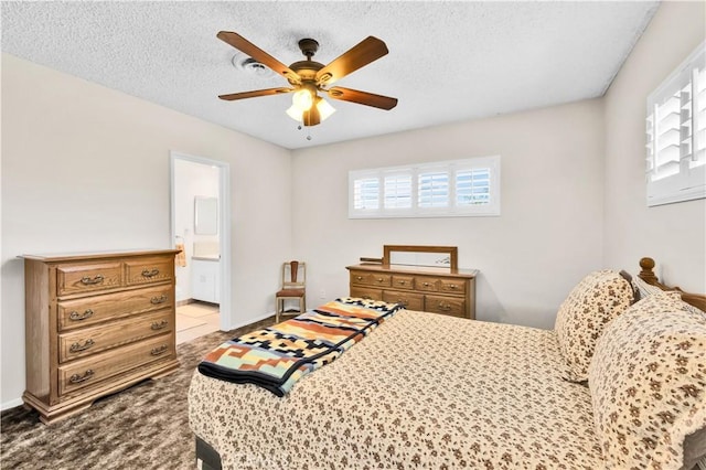 7599 Joshua Ln, Yucca Valley, CA 92284 - carpeted bedroom with ensuite bathroom, a textured ceiling, ceiling fan, and baseboards